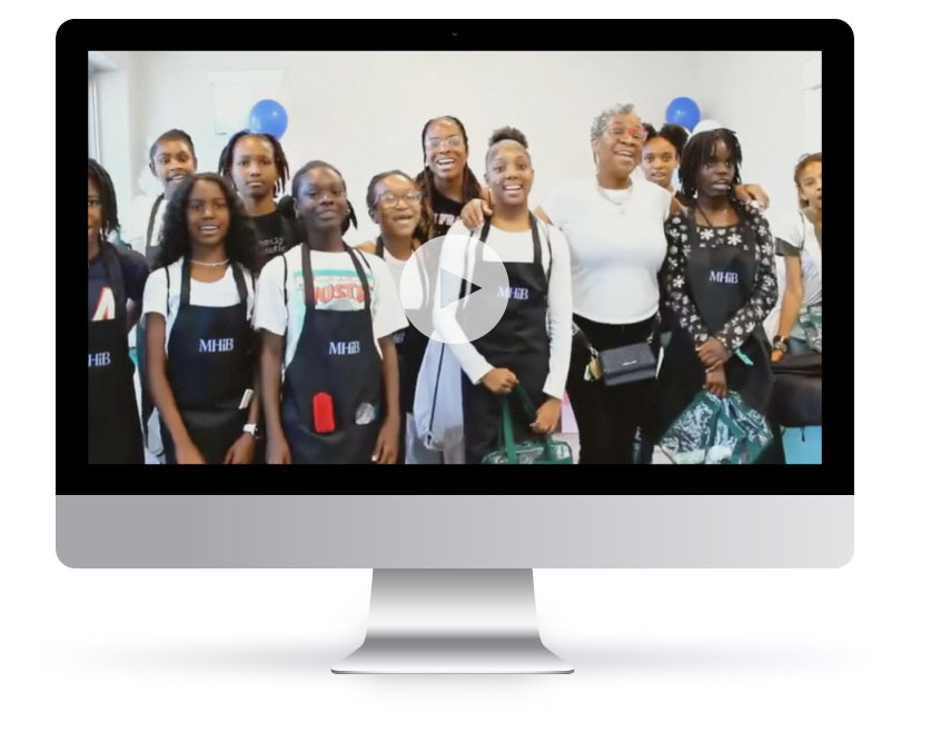 workshop with girls and video play button